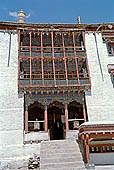 Ladakh - Hemis Gompa, the main monastery halls with the characteristc red painted windows and woden balconies on white washed faades 